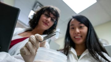 Caitlin Howell and her Graduate Research student Junie Fong, a PhD student in the Graduate School of Biomedical Science and Engineering, develop new components for medical catheters to help decrease the chance of infection with a new coating.
