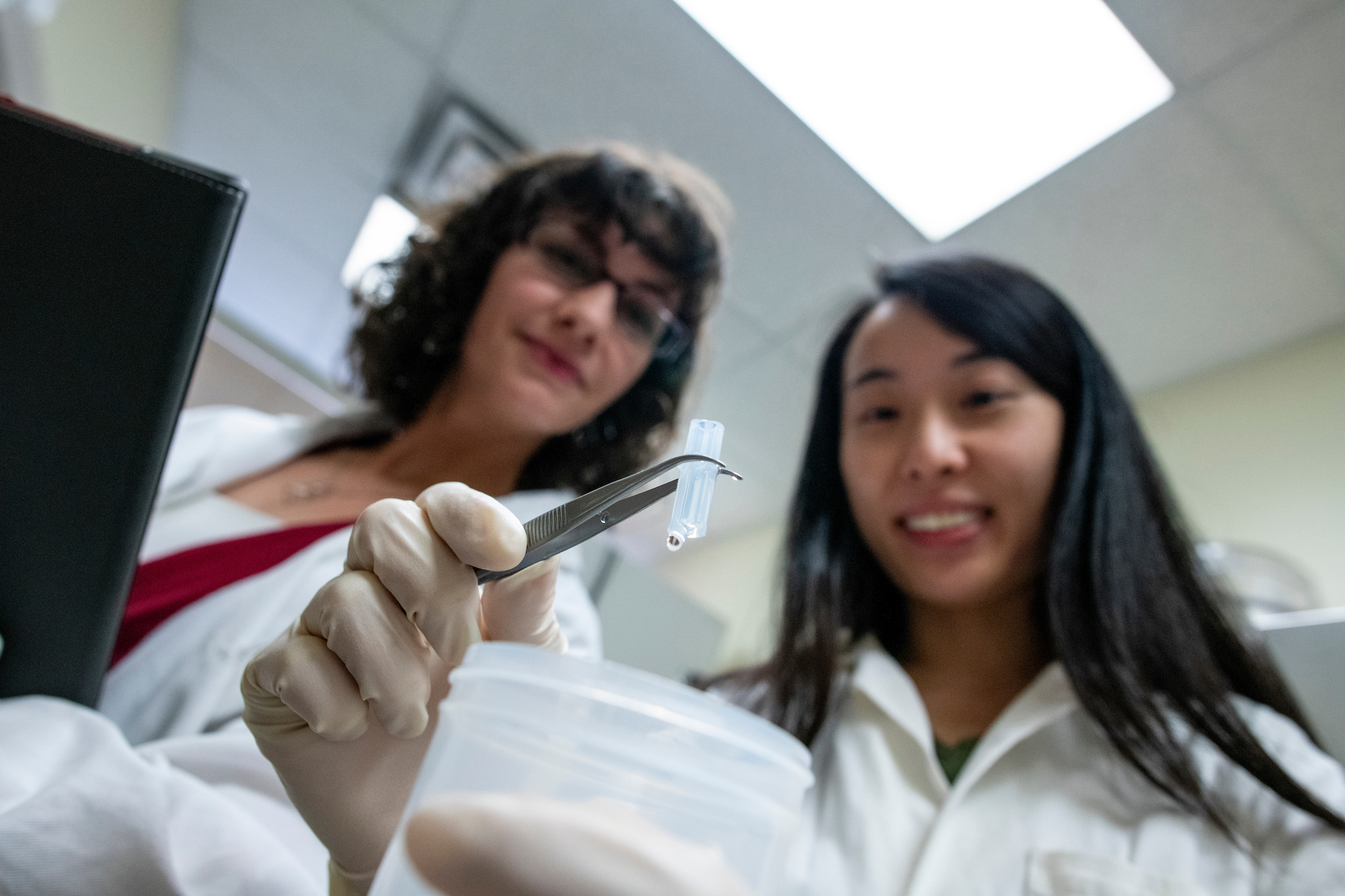 Caitlin Howell and her Graduate Research student Junie Fong, a PhD student in the Graduate School of Biomedical Science and Engineering, develop new components for medical catheters to help decrease the chance of infection with a new coating.