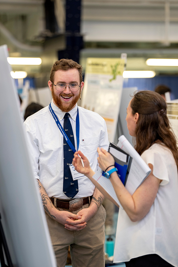 Student and visitor at the 2024 Student Symposium