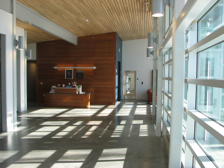 The interior lobby area of the Foster Center on a sunny day