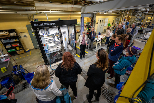 People on a tour of UMaine's Process Development Center