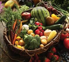 Picture of different vegetables and fruit in a woven basket