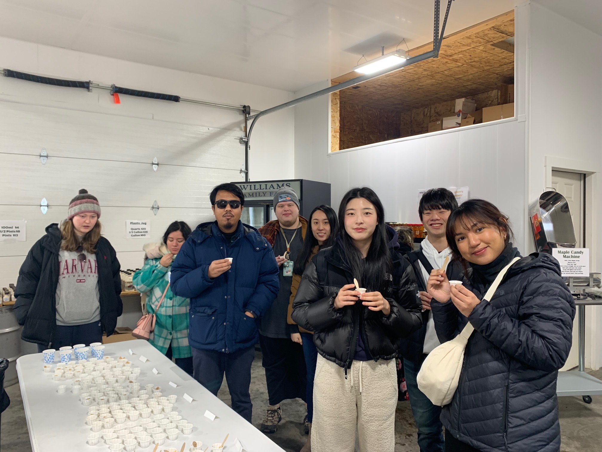International Students sampling local made maple syrup at a local sugar house on Maine Maple Sunday