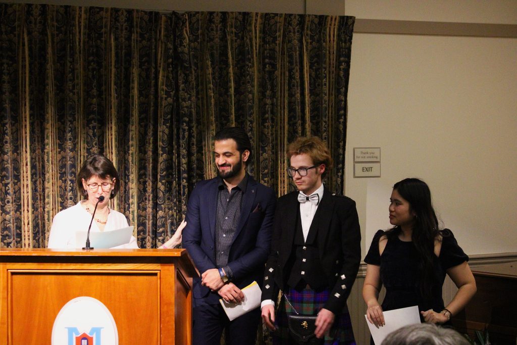 Sarah Joughin with ISA members at lectern