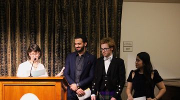 Sarah Joughin with ISA members at lectern