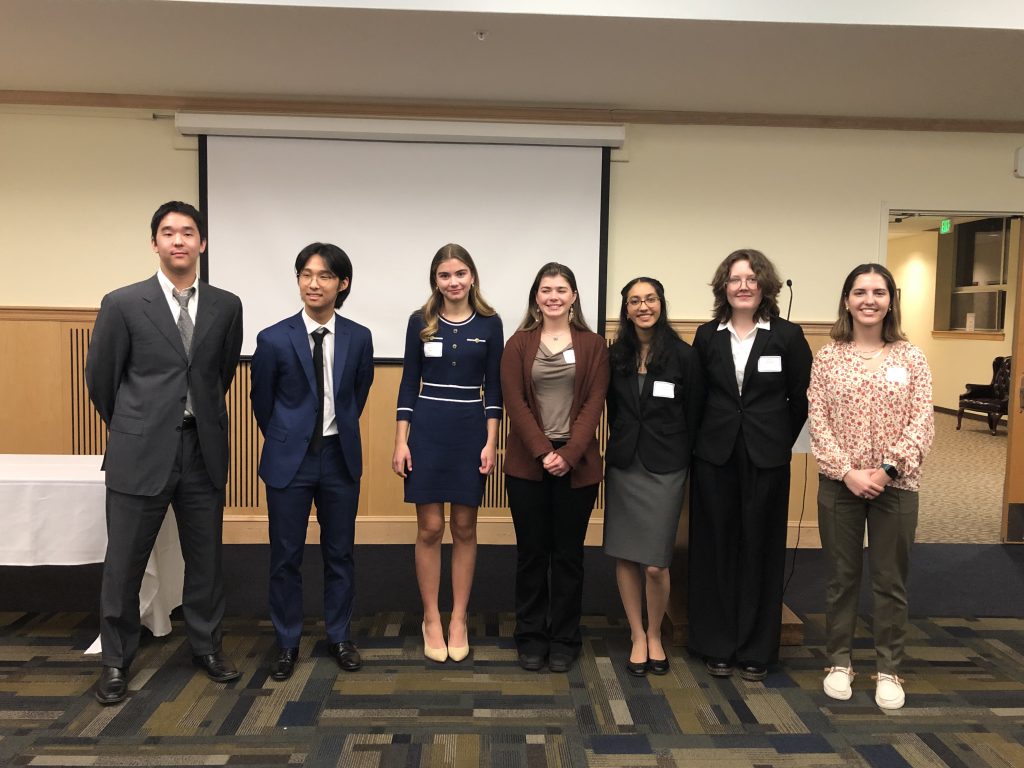 A photo of high school symposium students