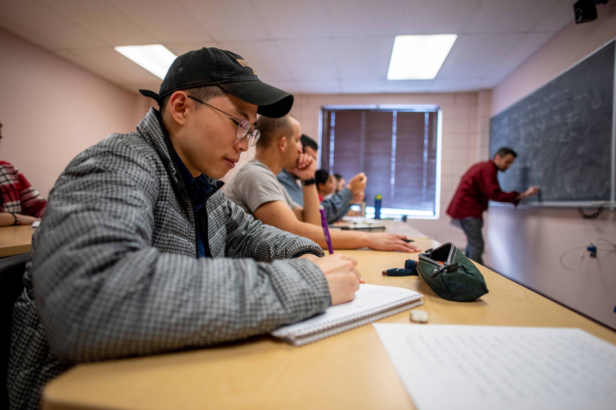 Graduate mathematics students in class