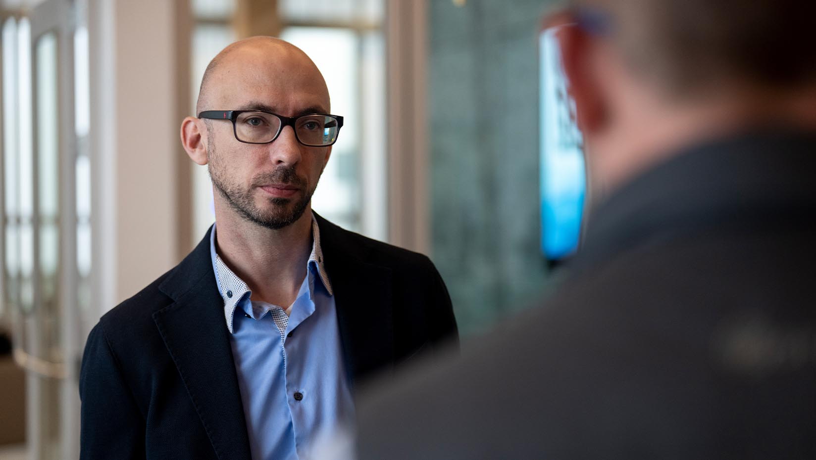A photo of a person being interviewed.
