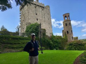 student in front of a castle in ireland