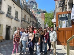 Participants in a class trip to Quebec City pose for a group photo.