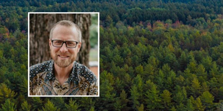 A portrait of Peter Ellis with an aerial image of a forest in the background.