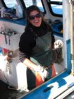 Chris Cash at the helm of her lobster boat.