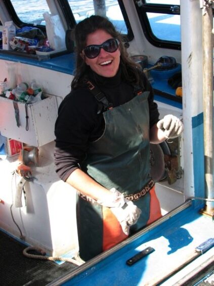 Chris Cash at the helm of her lobster boat.