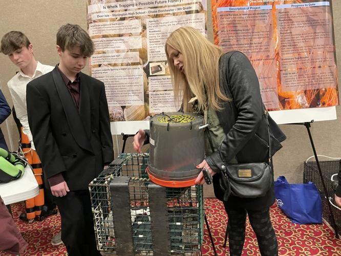 Student skipper demonstrates gear at the 2023 Fishermen's Forum