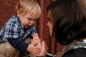 Mother and child clapping