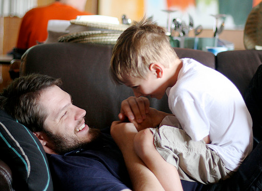 Father and son playing