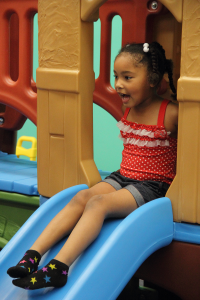 Young girl on slide