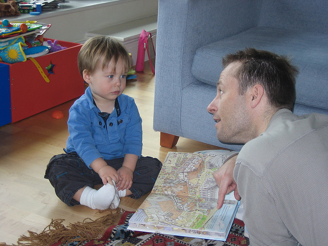 Young boy and Dad reading