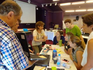 Teachers discussing at a workshop