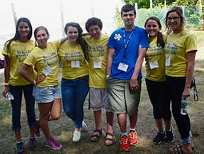 Group of UM student volunteers and teen volunteers