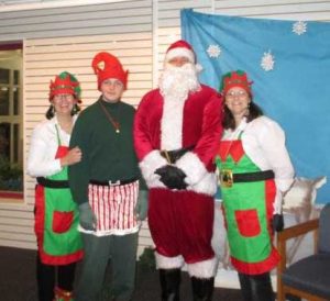 Santa with three elves