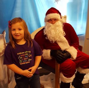 Young girl smiling with Santa
