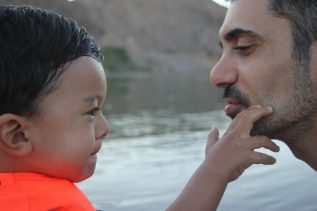 Father and young child face to face