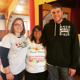 Two women and young man smiling