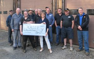 Group of auto service workers with MAIER staff and VP holding large check