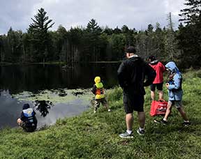 Family fishing at pond