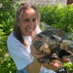 Photo of Chris Maher holding animal
