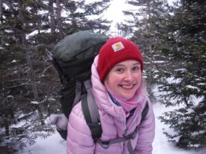 girl backpacking in the snow