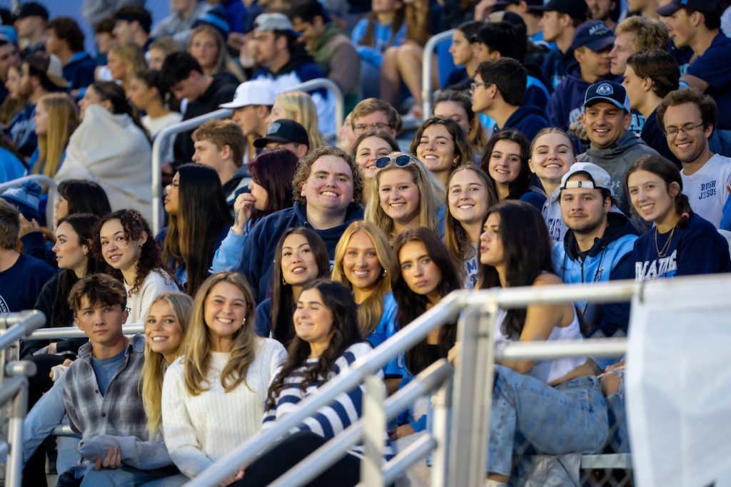 Happy UMaine students at a football game