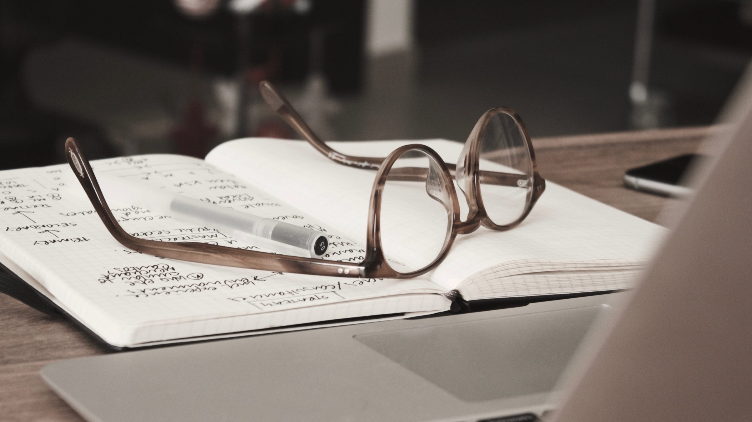 A photo of glasses on top of paper