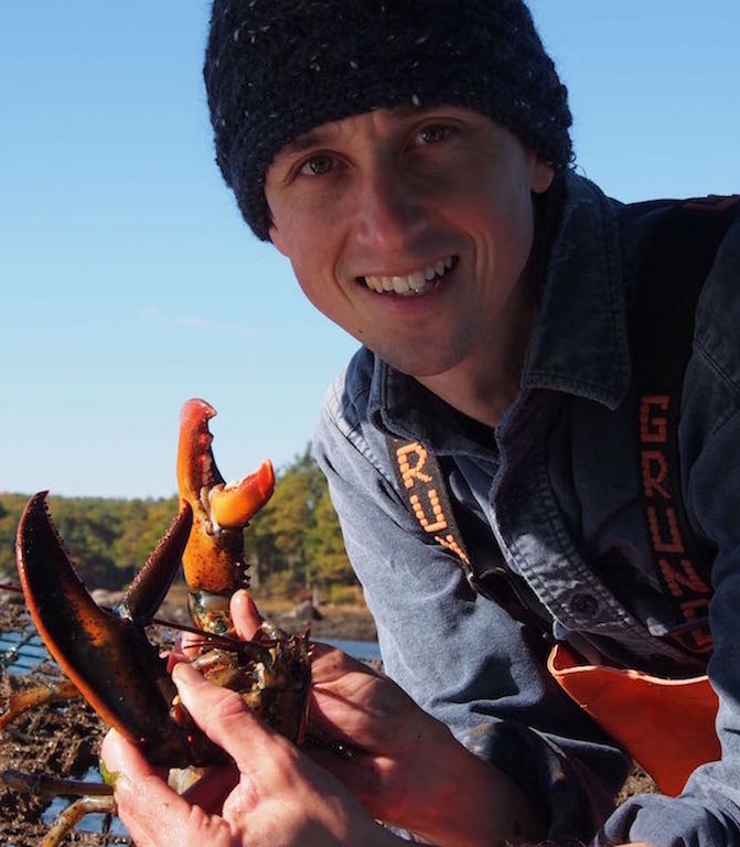 Photo of Josh Stoll holding a lobster