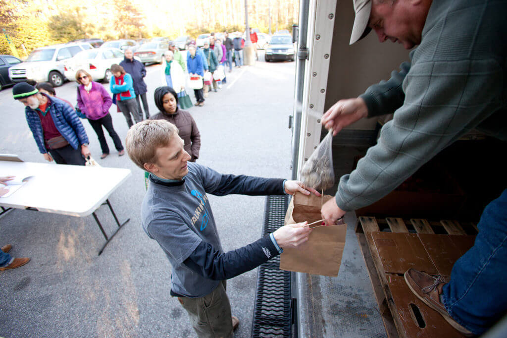 Members of a North Carolina Community Supported Fishery pick up their seafood orders