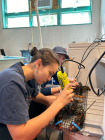 Madeleine Yung in a lab using lab equipment