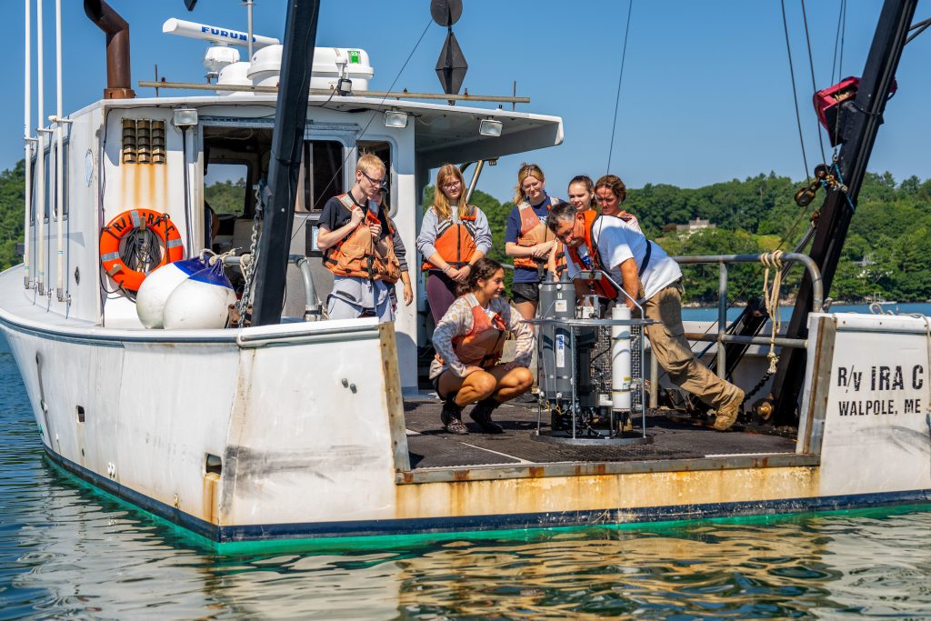 SMS students on a boat at the Darling Marine Center