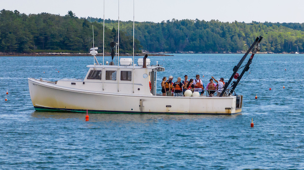 Students aboard a boat at the Darling Marine Center
