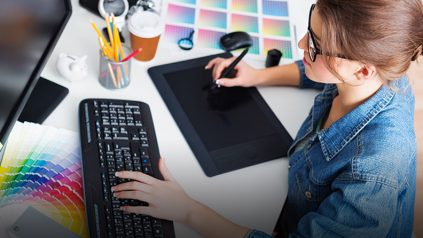 woman at computer creating design