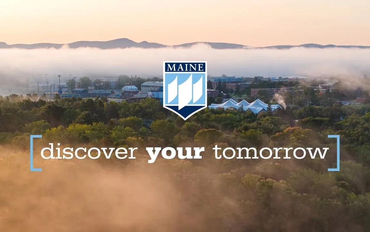 A photo of a sunrise with the UMaine logo and the words Discover Your Tomorrow