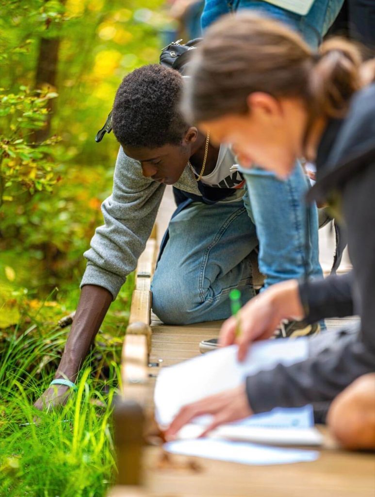 A photo of two students on the Orono Bog Walk