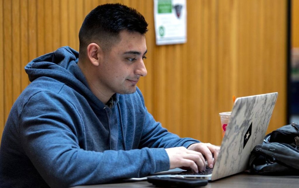 A photo of a person using a computer