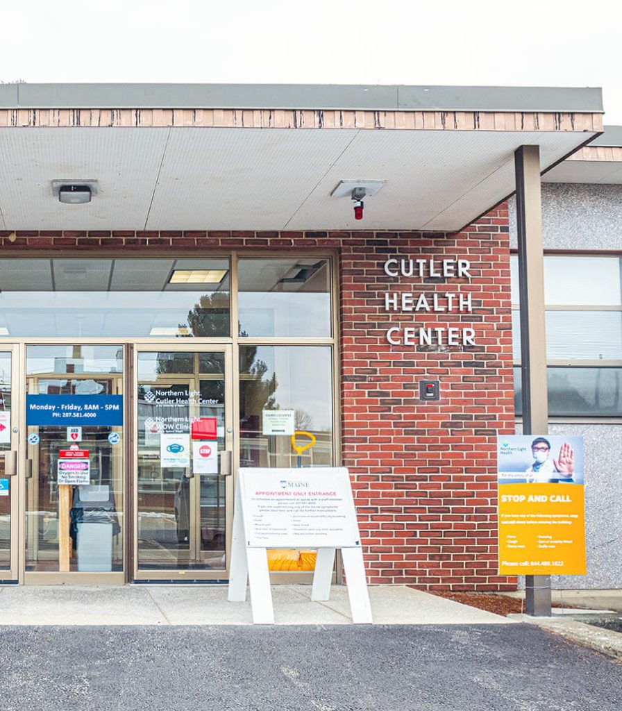 A photo of a sign in front of Cutler Health Center