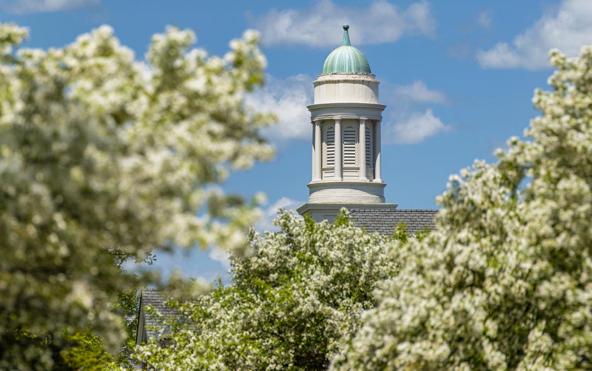 A photo of the top of a UMaine building