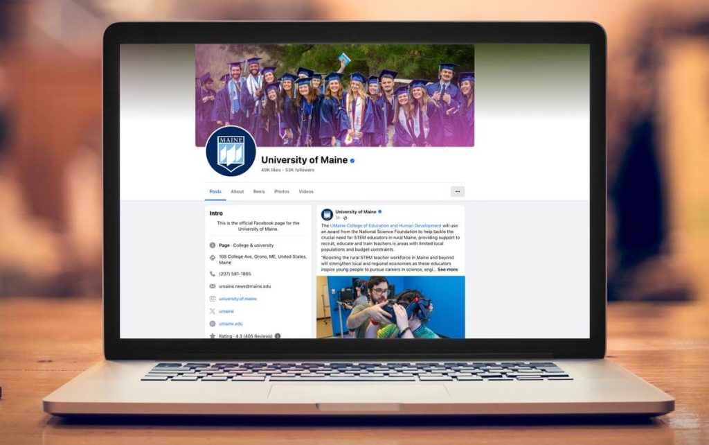 A photo of a laptop screen showing UMaine's Facebook page