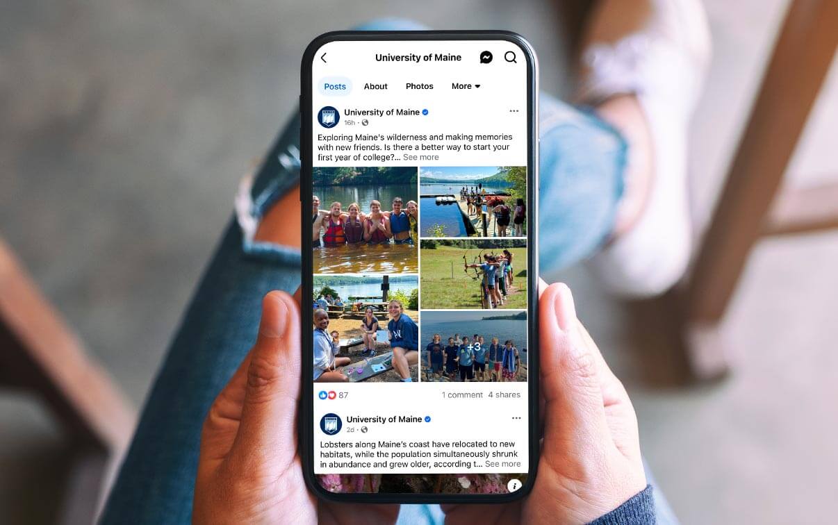 A photo of a cell phone screen showing UMaine Facebook posts