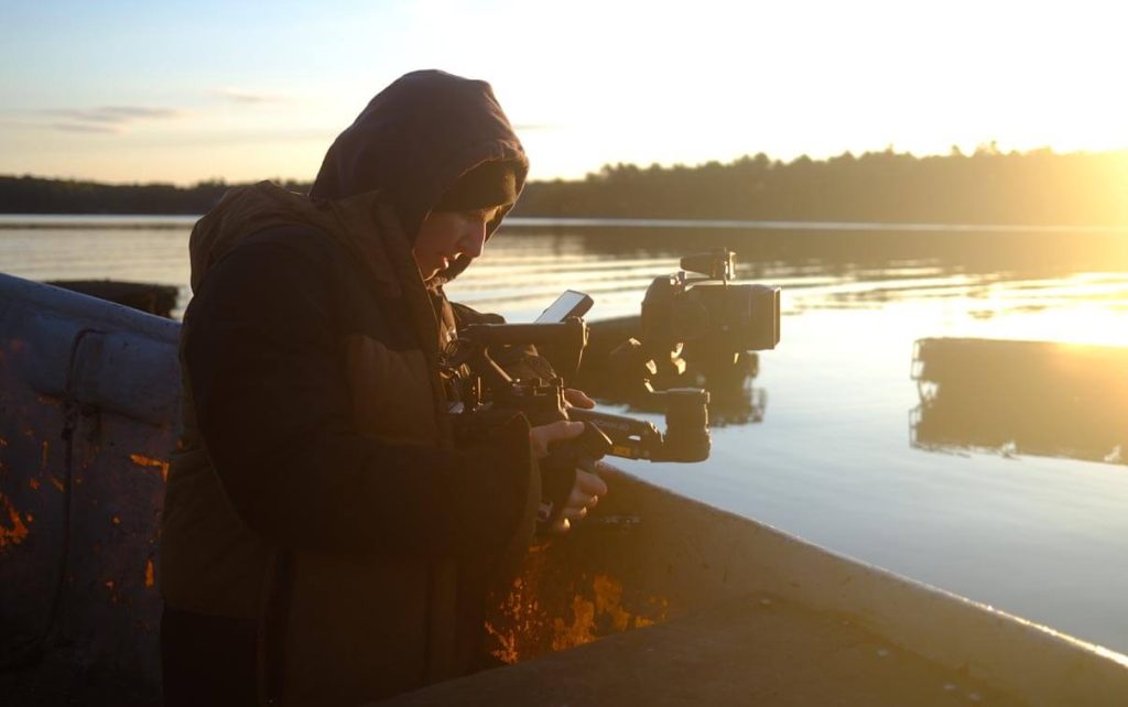 A photo of a person using a camera