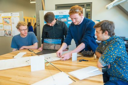 Mechanical Engineering students in a lab studying aerodynamics