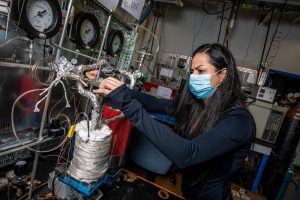 Engineering student working in a lab on chemical reactions